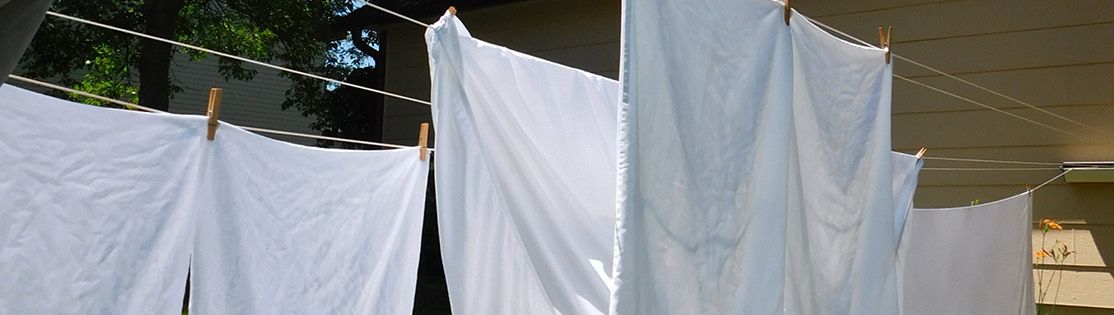 Hang sheets on clothesline