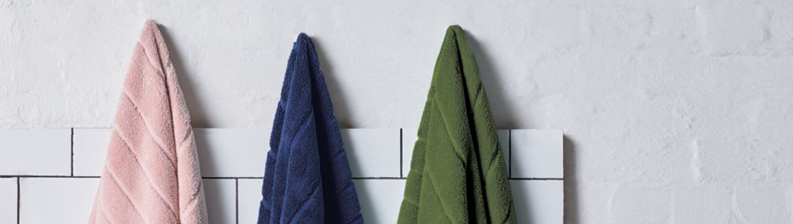 Cooper Towel range hung on hooks